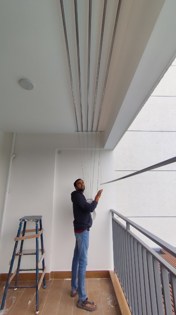 Professional Technician Fitting Ceiling Cloth Hangers